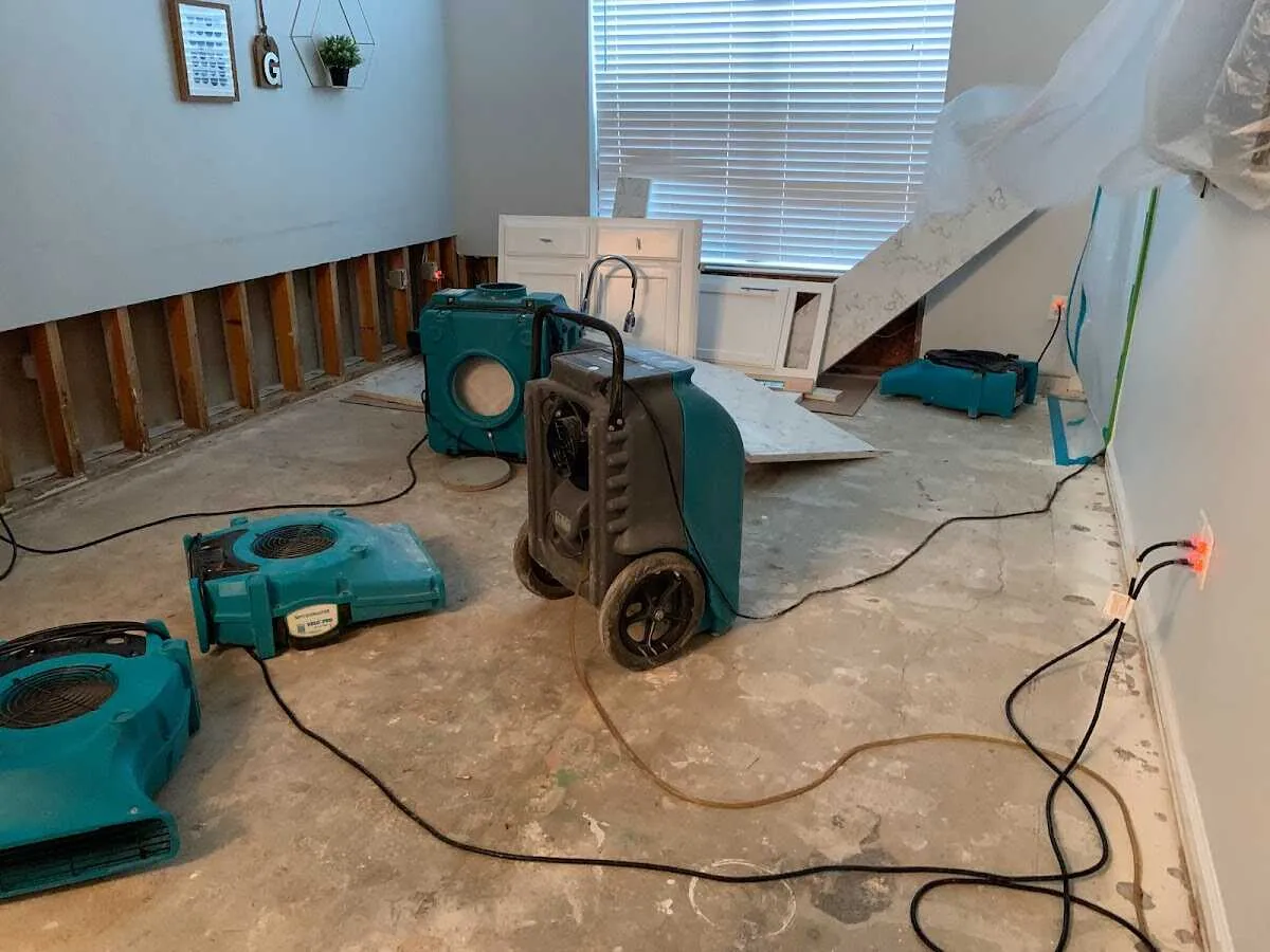 Dehumidifier in flood-cut room for Water Damage Restoration in Liberty
